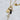 Multi charm gold necklace on a paperclip chain