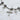 Multiple charms statement bracelet with a sun, stars, and moon and crosses.  Available in 18kt gold plating over stainless steel or silver tone stainless steel. Great for layering with other bracelets.