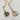 Moon and sun pendant necklace made with 18kt, non-tarnish,  waterproof metal. The moon and sun symbolize balance and harmony between opposing forces, often representing the duality of life. The sun typically embodies warmth, energy, and life, while the moon represents intuition, peace, and nurturing. These celestial bodies, when combined, signify the complementary nature of these qualities and can symbolize a deep, enduring connection.