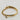 18kt gold stainless steel, non-tarnish, half bangle half link chain and a clear cz charm. Unique design and statement piece.