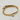 18kt gold stainless steel, non-tarnish, half bangle half link chain and a clear cz charm. Unique design and statement piece.