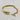 18kt gold stainless steel, non-tarnish, half bangle half link chain and a clear cz charm. Unique design and statement piece.