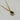 A mixed chain necklace with an emerald green oval pendant and sparkling crystal accents. A chic statement necklace for day or night.
