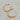 A pair of organic-shaped 18kt gold stainless steel hoop earrings with a textured, wavy finish, non-tarnish and waterproof. 