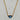 Large triangular shaped labradorite gemstone on a gold chain. 