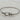 Silver twisted cable bracelet with buckle-inspired clasp and sparkling crystal accents. 