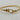 Gold twisted cable bracelet with buckle-inspired clasp and sparkling crystal accents. 