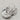 Silver rhodium plated chunky statement earrings. The unique shape and shiny texture add flair to any outfit, elevating your style.