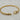 Gold twisted cable bracelet with polished buckle-inspired clasp.