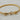 Gold twisted cable bracelet with sculptural hook-and-loop closure and sparkling crystal accents.