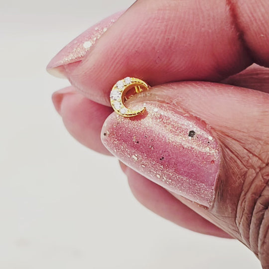 Sterling silver 14kt gold vermeil, crescent moon stud earrings. They have a minimal yet elegant look. They're great to wear with an earring stack. Very dainty and compliment all of your jewelry.
