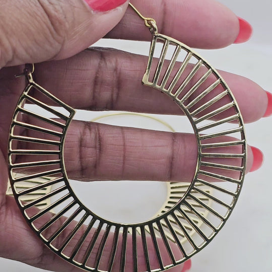 gold plated extra large bold hoop earrings with line details. Very unique design that makes a statement.