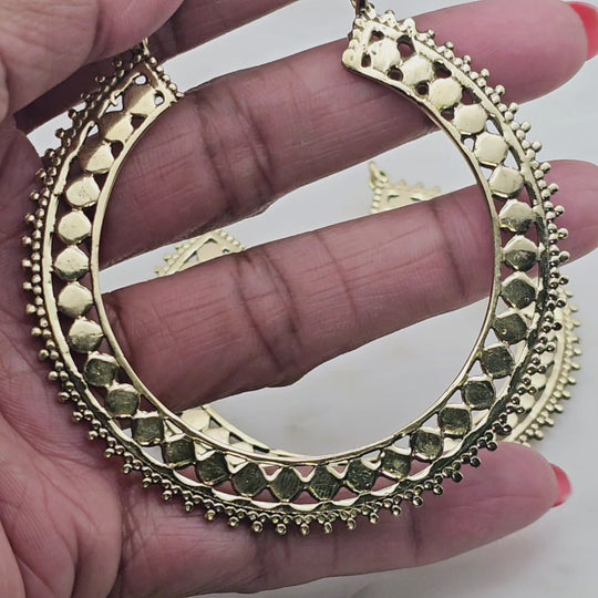 Boho chic extra-large bold hoop earrings with small circle design details. Very unique design that makes a statement.