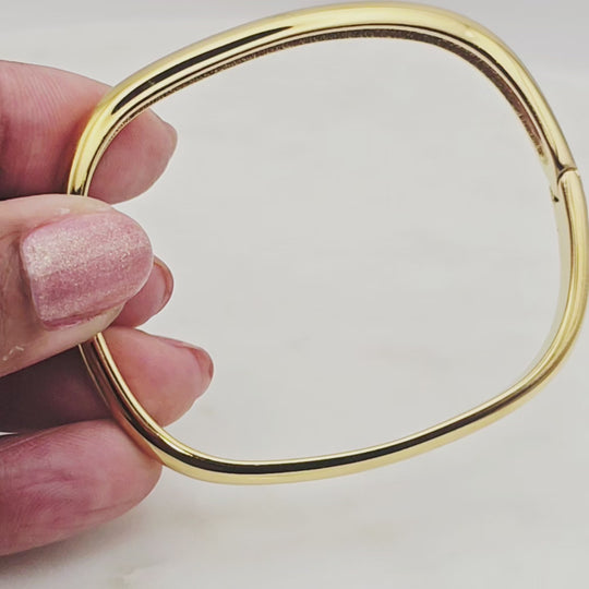 Non-tarnish, waterproof stainless steel and 18kt gold plated cuff bangle style. Unique square shape. Great for layering with other bangles, permanent jewelry bracelets or worn alone. Elegant and unique design.
