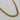 A gold stainless steel metal chain necklace with a woven, braided texture.