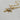 Gold-tone toggle necklace with a rectangular link chain, clear teardrop crystal, and sparkling celestial sunburst pendant.