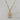 18kt gold plated, Stainless steel, non-tarnish necklace. The design is vintage inspired made with a cream and beige colored lucite material encased with stainless steel metal.