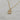 18kt gold plated, Stainless steel, non-tarnish necklace. The design is vintage inspired made with a cream and beige colored lucite material encased with stainless steel metal.