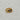 A gold signet-style ring with a teardrop-shaped clear stone.