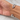 A close up of how the opening is of the silver-tone double layer cuff bracelet with a polished finish and sculptural curved V design.
