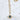 18kt gold stainless steel, non-tarnish necklace with blue enamel starburst pendant. Starburst symbolizes brilliance, energy, and radiance. Great to wear with other complimenting necklaces.